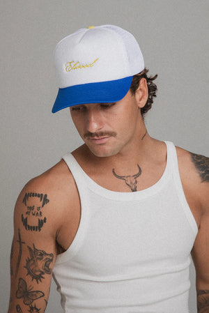 
                  
                    Load image into Gallery viewer, Elwood &amp;#39;Script&amp;#39; Trucker Hat - &amp;#39;Blue&amp;#39;
                  
                